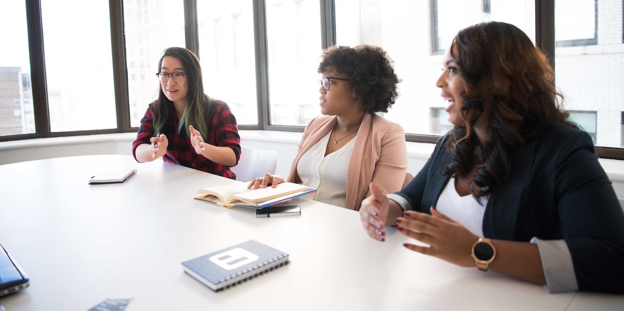 Inclusive Leadership. Business Roundtable. Woman having a meeting. Celeste Headlee 10 ways to have a better conversation essay.